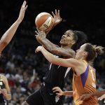 Las Vegas Aces forward Tamera Young shoots against Phoenix Mercury center Brittney Griner, left, and forward Stephanie Talbot (8) during the second half of a WNBA basketball game, Wednesday, Aug. 1, 2018, in Las Vegas. (AP Photo/John Locher)