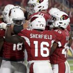 Members of the Arizona Cardinals celebrates after a touchdown by wide receiver Greg Little during the first half of a preseason NFL football game against the Denver Broncos Thursday, Aug. 30, 2018, in Glendale, Ariz. (AP Photo/Rick Scuteri)