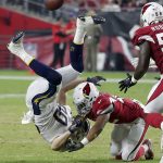 Arizona Cardinals defensive back A.J. Howard, right, commits a personal foul against Los Angeles Chargers tight end Sean Culkin for a 15-yard penalty during the first half of a preseason NFL football game, Saturday, Aug. 11, 2018, in Glendale, Ariz. (AP Photo/Rick Scuteri)