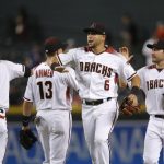 Arizona Diamondbacks' Ketel Marte (4), Nick Ahmed (13), David Peralta (6) and A.J. Pollock, right, celebrate the team's 5-1 win against the Los Angeles Angels in a baseball game Wednesday, Aug. 22, 2018, in Phoenix. (AP Photo/Ross D. Franklin)