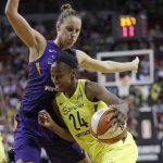 Seattle Storm's Jewell Loyd (24) drives against Phoenix Mercury's Stephanie Talbot on the way to the basket in the second half of Game 1 of a WNBA basketball playoff semifinal Sunday, Aug. 26, 2018, in Seattle. The Storm won 91-87. (AP Photo/Elaine Thompson)
