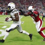 Los Angeles Chargers wide receiver Geremy Davis (11) scores a touchdown as Arizona Cardinals defensive back Chris Campbell (33) defends during the second half of a preseason NFL football game, Saturday, Aug. 11, 2018, in Glendale, Ariz. (AP Photo/Rick Scuteri)