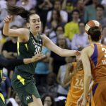 Seattle Storm's Breanna Stewart (30) and Alysha Clark (32) defend as Phoenix Mercury's Diana Taurasi (3) gets off a pass in the second half in a WNBA basketball playoff semifinal, Tuesday, Aug. 28, 2018, in Seattle. The Storm won 91-87 in overtime. (AP Photo/Elaine Thompson)