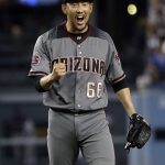 Arizona Diamondbacks relief pitcher Yoshihisa Hirano celebrates after getting Los Angeles Dodgers' Matt Kemp to ground into an inning-ending double play during the eighth inning of a baseball game Thursday, Aug. 30, 2018, in Los Angeles. (AP Photo/Marcio Jose Sanchez)