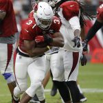 Arizona Cardinals running back David Johnson (31) runs with the ball next to defensive back Tre Boston, right, during an NFL football practice Saturday, Aug. 4, 2018, in Glendale, Ariz. (AP Photo/Ross D. Franklin)