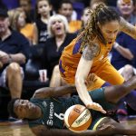 Seattle Storm forward Natasha Howard (6) battles with Phoenix Mercury center Brittney Griner for a loose ball during the first half of Game 3 of a WNBA basketball playoffs semifinal Friday, Aug. 31, 2018, in Phoenix. The Mercury defeated the Storm 86-66. (AP Photo/Ross D. Franklin)