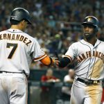 San Francisco Giants Andrew McCutchen celebrates with Gorkys Hernandez (7) after hitting a solo home run against the Arizona Diamondbacks in the third inning during a baseball game, Saturday, Aug. 4, 2018, in Phoenix. (AP Photo/Rick Scuteri)