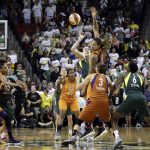 Phoenix Mercury's Brittney Griner, center right, wins the tipoff over Seattle Storm's Breanna Stewart to start overtime in a WNBA basketball playoff semifinal, Tuesday, Aug. 28, 2018, in Seattle. The Storm won 91-87 in overtime. (AP Photo/Elaine Thompson)