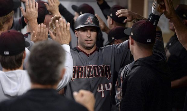 Arizona Diamondbacks' Paul Goldschmidt is congratulated in the dugout after scoring on a single by ...