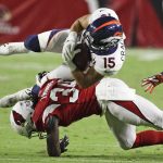 Denver Broncos wide receiver River Cracraft, is tackled by Arizona Cardinals cornerback Tavierre Thomas during the second half of a preseason NFL football game Thursday, Aug. 30, 2018, in Glendale, Ariz. (AP Photo/Rick Scuteri)