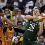 Seattle Storm's Breanna Stewart (30) looks to pass as Phoenix Mercury's DeWanna Bonner defends in the first half in a WNBA basketball playoff semifinal Tuesday, Aug. 28, 2018, in Seattle. (AP Photo/Elaine Thompson)