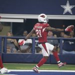 Arizona Cardinals defensive back Patrick Peterson (21) runs into the end zone with a touchdown followed by teammate Benson Mayowa (91) after an interception during the first half of a preseason NFL football game against the Dallas Cowboys in Arlington, Texas, Sunday, Aug. 26, 2018. (AP Photo/Michael Ainsworth)