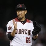 Arizona Diamondbacks relief pitcher Yoshihisa Hirano, of Japan, claps after final out against the Los Angeles Angels in a baseball game Wednesday, Aug. 22, 2018, in Phoenix. The Diamondbacks defeated the Angels 5-1. (AP Photo/Ross D. Franklin)