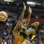 Seattle Storm guard Jewell Loyd, right, is unable to drive past Phoenix Mercury forward Camille Little, left, and guard Leilani Mitchell, middle, during the first half of Game 3 of a WNBA basketball playoffs semifinal Friday, Aug. 31, 2018, in Phoenix. The Mercury defeated the Storm 86-66. (AP Photo/Ross D. Franklin)