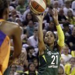 Seattle Storm's Jordin Canada shoots, and scores on, a three-point shot against the Phoenix Mercury in the first half in a WNBA basketball playoff semifinal Tuesday, Aug. 28, 2018, in Seattle. (AP Photo/Elaine Thompson)