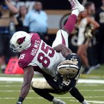New Orleans Saints defensive back J.T. Gray (48) tackles Arizona Cardinals tight end Gabe Holmes (85) in the first half of an NFL preseason football game in New Orleans, Friday, Aug. 17, 2018. (AP Photo/Bill Feig)