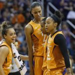 Phoenix Mercury guard Yvonne Turner, second from right, celebrates her score against the Seattle Storm with guard Briann January (12), forward DeWanna Bonner, second from left, and guard Leilani Mitchell, left, during the second half of Game 3 of a WNBA basketball playoffs semifinal Friday, Aug. 31, 2018, in Phoenix. The Mercury defeated the Storm 86-66. (AP Photo/Ross D. Franklin)