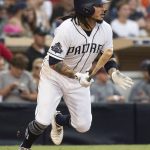 San Diego Padres' Freddy Galvis hits a two-run single during the fourth inning of a baseball game against the Arizona Diamondbacks in San Diego, Saturday, Aug. 18, 2018. (AP Photo/Kyusung Gong)