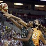 Phoenix Mercury's Brittney Griner (42) fouls Seattle Storm's Jewell Loyd (24) in the first half in a WNBA basketball playoff semifinal, Tuesday, Aug. 28, 2018, in Seattle. (AP Photo/Elaine Thompson)