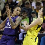 Phoenix Mercury's Brittney Griner (42) backs into Seattle Storm's Breanna Stewart during the first half of Game 1 in a WNBA basketball playoff semifinal Sunday, Aug. 26, 2018, in Seattle. (AP Photo/Elaine Thompson)
