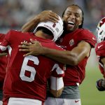 Arizona Cardinals wide receiver Larry Fitzgerald (11) hugs quarterback Chad Kanoff (6) after a touchdown pass against the Los Angeles Chargers during the second half of a preseason NFL football game, Saturday, Aug. 11, 2018, in Glendale, Ariz. (AP Photo/Ross D. Franklin)