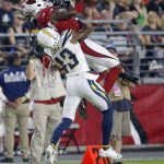 Los Angeles Chargers cornerback Michael Davis (43) breaks up a pass intended for Arizona Cardinals wide receiver Greg Little (18) during the first half of a preseason NFL football game, Saturday, Aug. 11, 2018, in Glendale, Ariz. (AP Photo/Ross D. Franklin)
