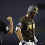 The San Diego Padres' Eric Hosmer, right, reacts as umpire James Hoye calls a strike during the first inning of the team's baseball game against the Arizona Diamondbacks on Friday, Aug. 17, 2018, in San Diego. (AP Photo/Gregory Bull)