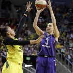 Phoenix Mercury's Diana Taurasi (3) shoots in front of Seattle Storm's Alysha Clark in the first half of a WNBA basketball playoff semifinal Sunday, Aug. 26, 2018, in Seattle. (AP Photo/Elaine Thompson)