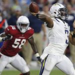 Los Angeles Chargers quarterback Geno Smith (3) throws as Arizona Cardinals linebacker Edmond Robinson (58) looks on during the second half of a preseason NFL football game, Saturday, Aug. 11, 2018, in Glendale, Ariz. (AP Photo/Ross D. Franklin)