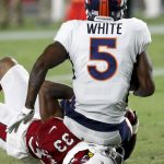 Denver Broncos wide receiver DeAndrew White is tackled by Arizona Cardinals defensive back Chris Campbell during the second half of a preseason NFL football game Thursday, Aug. 30, 2018, in Glendale, Ariz. (AP Photo/Matt York)