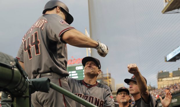 Arizona Diamondbacks' Paul Goldschmidt (44) is greeted in the dugout by manager Torey Lovullo, cent...