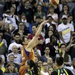Subdued Seattle Storm fans look on as Phoenix Mercury's Diana Taurasi nails a 3-point shot with seconds left in the second half to send the game into overtime in a WNBA basketball playoff semifinal, Tuesday, Aug. 28, 2018, in Seattle. The Storm won 91-87 in overtime. (AP Photo/Elaine Thompson)