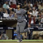 Arizona Diamondbacks' Eduardo Escobar reacts after hitting a home run during the eighth inning against the San Diego Padres in a baseball game Friday, Aug. 17, 2018, in San Diego. (AP Photo/Gregory Bull)