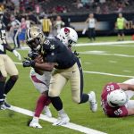 New Orleans Saints quarterback J.T. Barrett (5) carries four touchdown in the second half of an NFL preseason football game against the Arizona Cardinals in New Orleans, Friday, Aug. 17, 2018. The Cardinlas won 20-15. (AP Photo/Bill Feig)