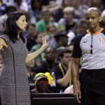 Phoenix Mercury head coach Sandy Brondello, left, complains to an official in the first half of a WNBA basketball playoff semifinal against the Seattle Storm, Sunday, Aug. 26, 2018, in Seattle. (AP Photo/Elaine Thompson)
