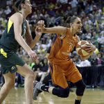 Phoenix Mercury's Diana Taurasi (3) races past Seattle Storm's Breanna Stewart in the first half in a WNBA basketball playoff semifinal Tuesday, Aug. 28, 2018, in Seattle. (AP Photo/Elaine Thompson)