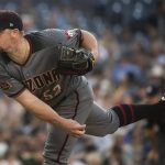Arizona Diamondbacks starting pitcher Zack Godley delivers a pitch during the third inning of a baseball game against the San Diego Padres in San Diego, Saturday, Aug. 18, 2018. (AP Photo/Kyusung Gong)