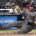 Arizona Diamondbacks' A.J. Pollock slides to score during the seventh inning of the team's baseball game against the San Diego Padres in San Diego, Saturday, Aug. 18, 2018. (AP Photo/Kyusung Gong)