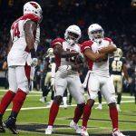 Arizona Cardinals wide receiver Christian Kirk, right, celebrates his touchdown reception with wide receiver Chad Williams (10) and offensive tackle D.J. Humphries (74) in the first half of an NFL preseason football game in New Orleans, Friday, Aug. 17, 2018. (AP Photo/Butch Dill)