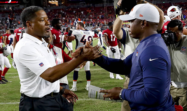 Arizona Cardinals head coach Steve Wilks, left, greets Denver Broncos head coach Vance Joseph after...