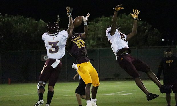 Arizona State wide receiver Kyle Williams comes down with the reception in double coverage during t...