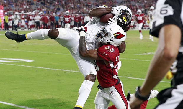 Los Angeles Chargers wide receiver Geremy Davis pulls in a touchdown pass as Arizona Cardinals defe...