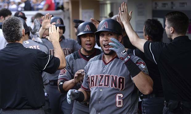 Arizona Diamondbacks' David Peralta reacts in the dugout after hitting a three-run home run during ...