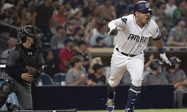 San Diego Padres' Christian Villanueva heads to first with a walk-off single  against the Arizona D...