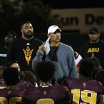 Arizona State head coach Herm Edwards talks with his players after the team’s first scrimmage of the season Saturday, Aug. 11, in Tempe. (Tyler Drake/Arizona Sports)