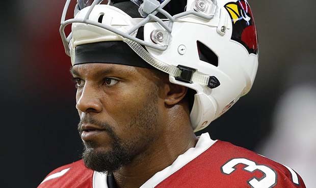 Arizona Cardinals running back David Johnson takes a break after running plays with the offense dur...