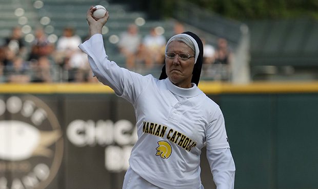 Sister Mary Jo Sobieck throws out a ceremonial first pitch before a baseball game between the Kansa...