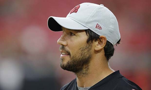 Arizona Cardinals quarterback Sam Bradford watches teammates from the sidelines during an NFL footb...