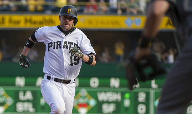 Pittsburgh Pirates' Chris Stewart (19) heads to third base with a two-run triple off Arizona Diamon...