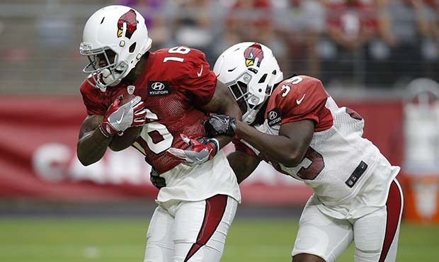 Arizona Cardinals wide receiver Trent Sherfield (16) makes a catch in front of cornerback Deatrick ...